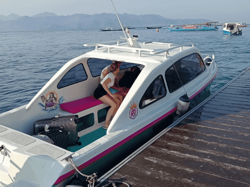 Private speed boat docked at Teluk Nare Harbor - Starting point for Gili Islands transfer